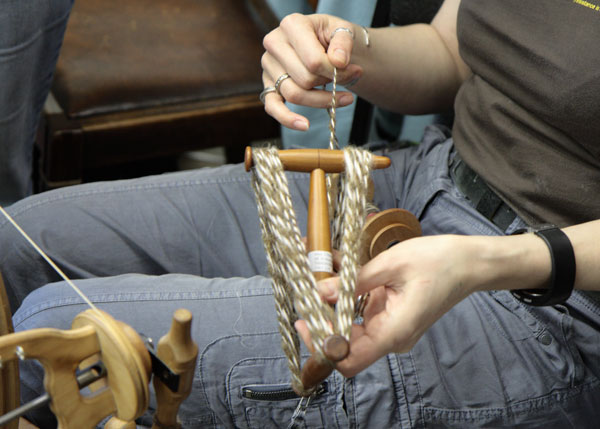 Juliet winds yarn onto a niddy noddy (yes thats a real thing) Juliet winds yarn onto a niddy noddy (yes thats a real thing)